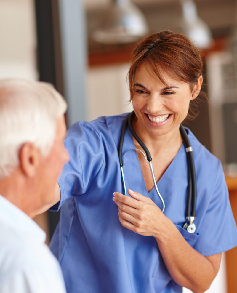Clinician smiling at a patient